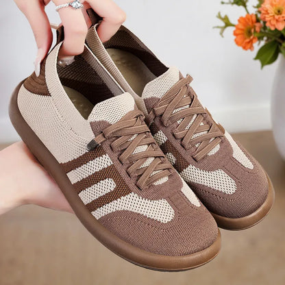Retro style casual training shoes in flyknit mesh with a soft PU sole and flat heel.
