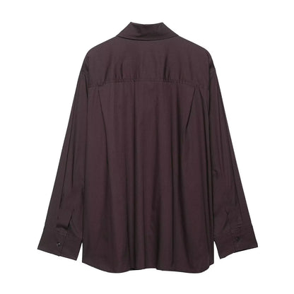 Brown women's loose-fit poplin shirt with long sleeves and an attached bow tie scarf.
