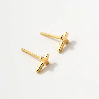 Women's gold bow cross stud earrings in zinc alloy with geometric design