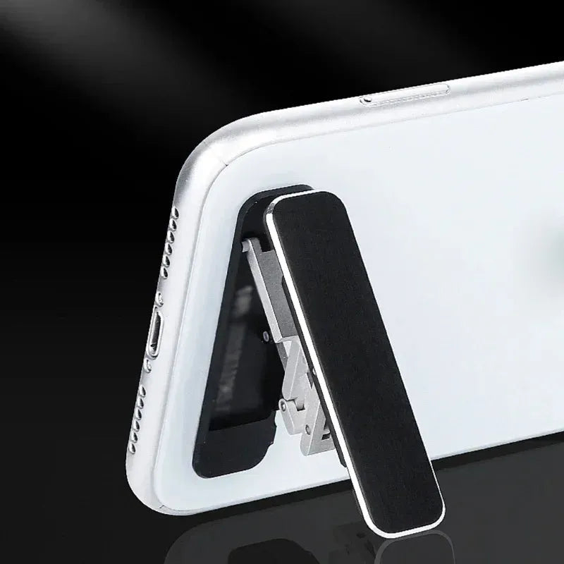 Aluminium folding mobile phone holder with backstick adhesive shown in black colour at 4mm thickness