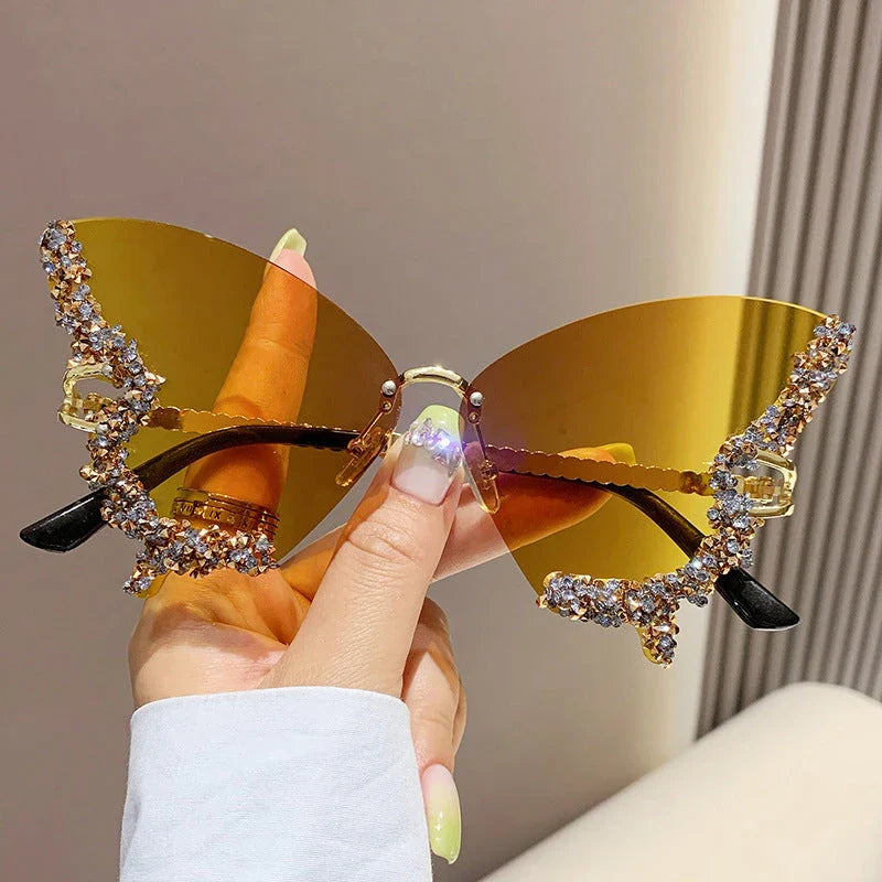 Chic butterfly-shaped sunglasses with diamond accents in various gradient color options