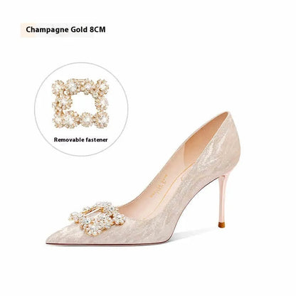 Champagne gold pointed-toe high heel pumps with stiletto heel and rhinestone decoration on the upper.