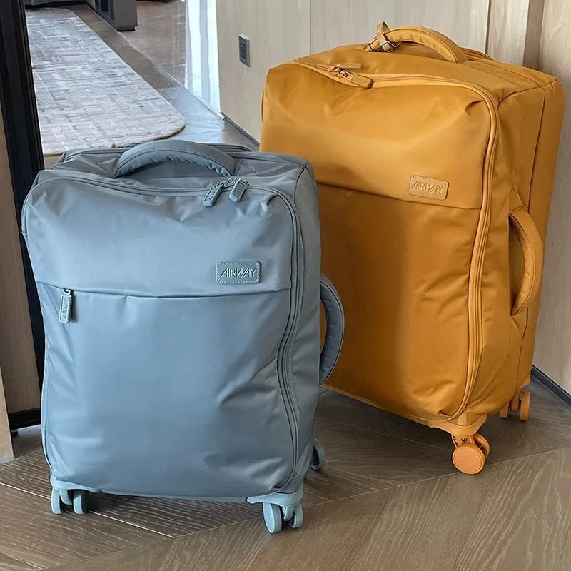 Ultra-light waterproof Oxford cloth suitcase in bluestone green with universal wheels showing 20-inch size dimensions