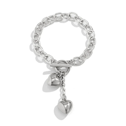 Elegant chain necklace and bracelet set with shiny lock and key pendant, fashionable ladies accessories