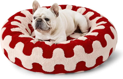 Round blue and white plaid dog bed with plastic sides on wooden floor