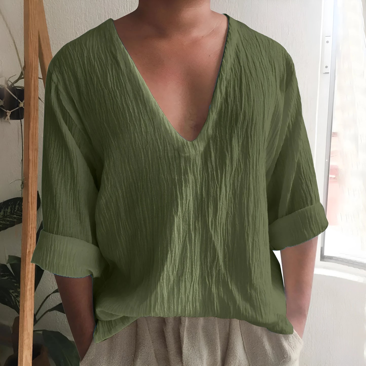 Men's long sleeve V-neck t-shirt in washed cotton, shown in a solid colour.