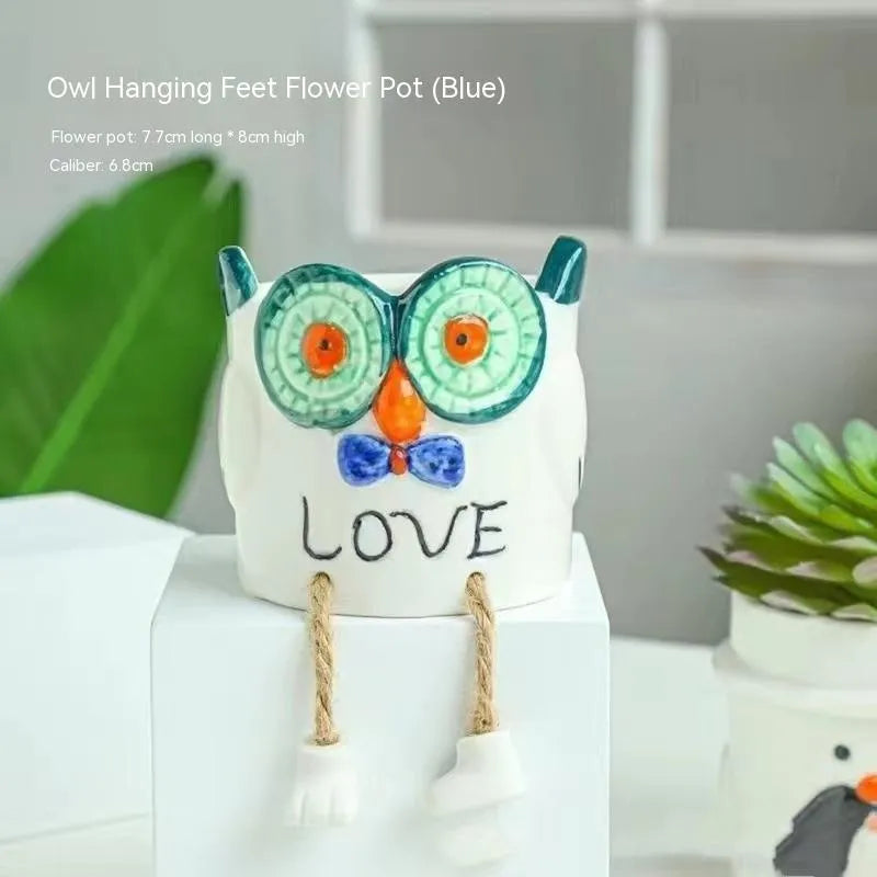 Ceramic hanging foot flowerpot with cartoon design for succulents on desktop