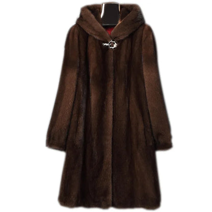 Woman wearing a long black faux fur hooded coat in a street fashion style.