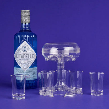 Transparent six-shot glass dispenser rack with individual covers on a wooden bar
