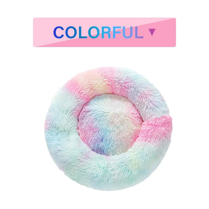Fluffy donut-shaped pet bed with raised bolster edge in long plush material