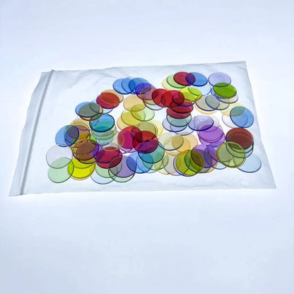Bag of 100 plastic counting chips in 19mm or 25mm size, solid colour or transparent, for children aged 4 to 6
