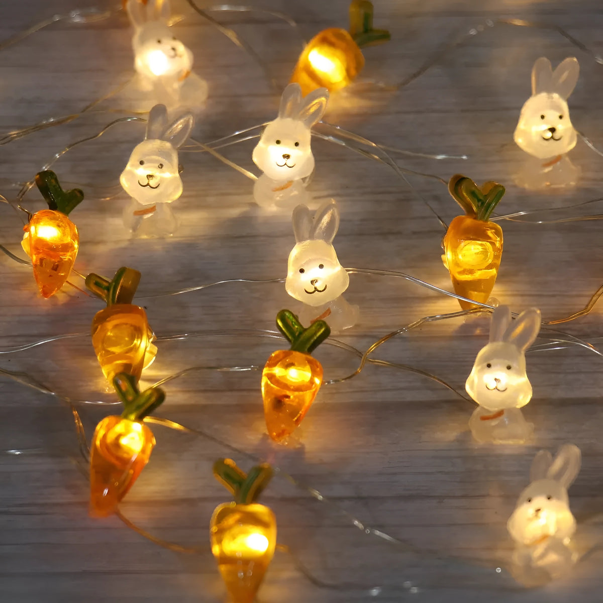 Easter LED bunny string lights with carrot and transparent white rabbit shapes on flexible copper wire