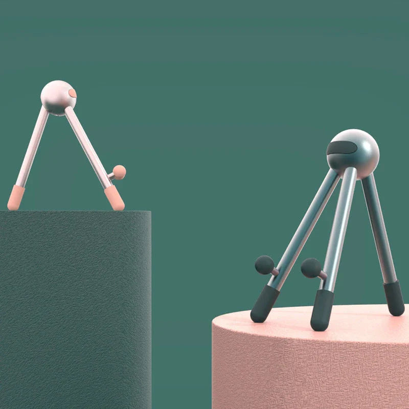 Adjustable desk stand in pink and green alien-inspired designs, featuring a mobile phone and tablet holder with 120-degree angle adjustment