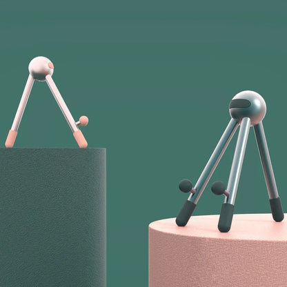 Adjustable desk stand in pink and green alien-inspired designs, featuring a mobile phone and tablet holder with 120-degree angle adjustment