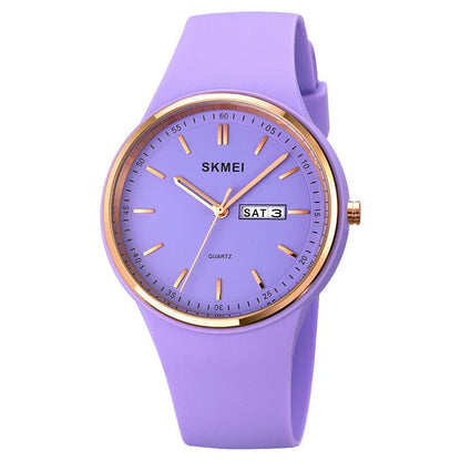 Women's quartz watch with a silicone strap and calendar on a 42mm white dial.