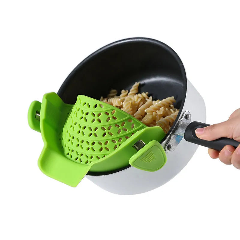 Silicone and stainless steel pot side drain stopper kitchen gadget in assorted colours.