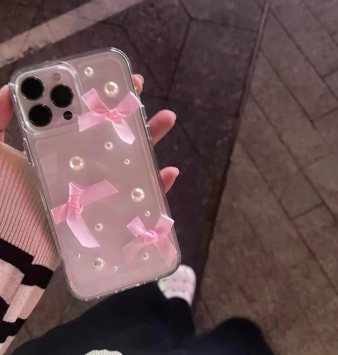Transparent TPU iPhone case with three-dimensional pearl bow, anti-fall all-inclusive design, colour-matching finish