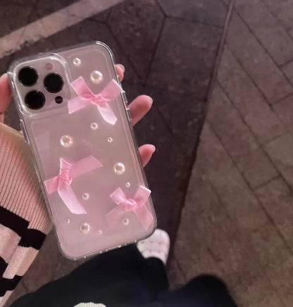 Transparent TPU iPhone case with three-dimensional pearl bow, anti-fall all-inclusive design, colour-matching finish