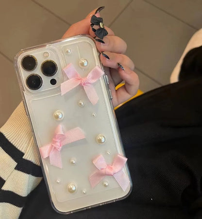 Transparent TPU iPhone case with three-dimensional pearl bow, anti-fall all-inclusive design, colour-matching finish
