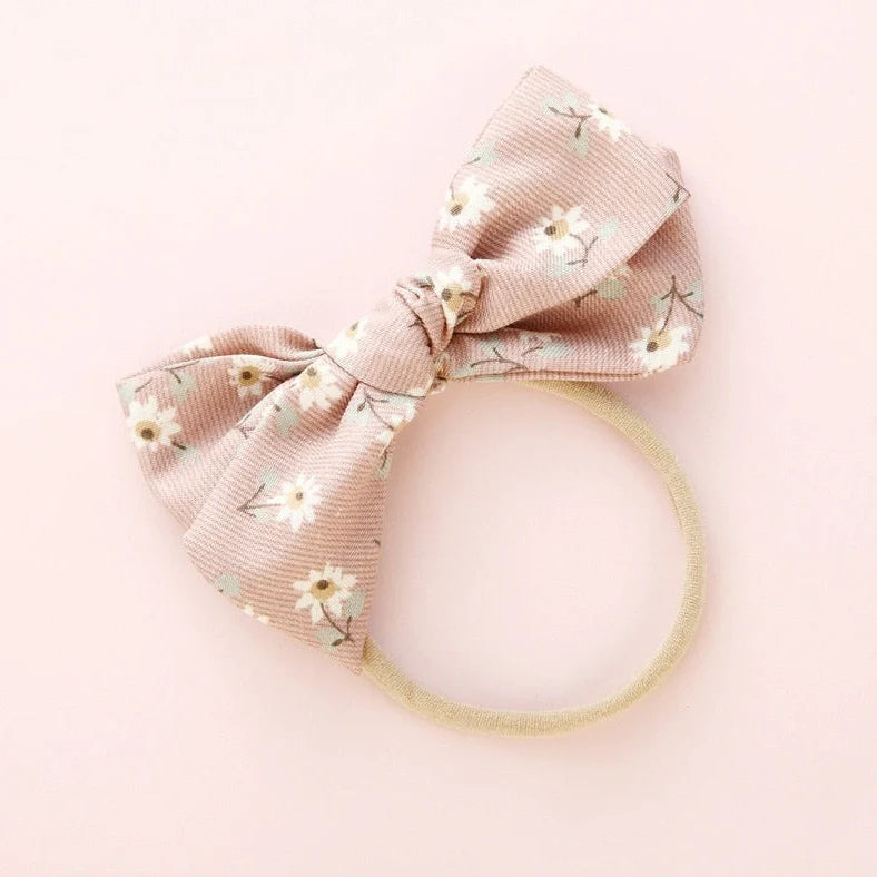 Children's cloth hair band with knotted bow design in one of six colour options