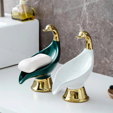 Ceramic swan soap rack in white and green, featuring a drainage cover
