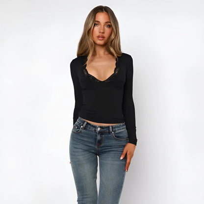 Women's slim fit black pullover top with long sleeves and decorative lace floral design.