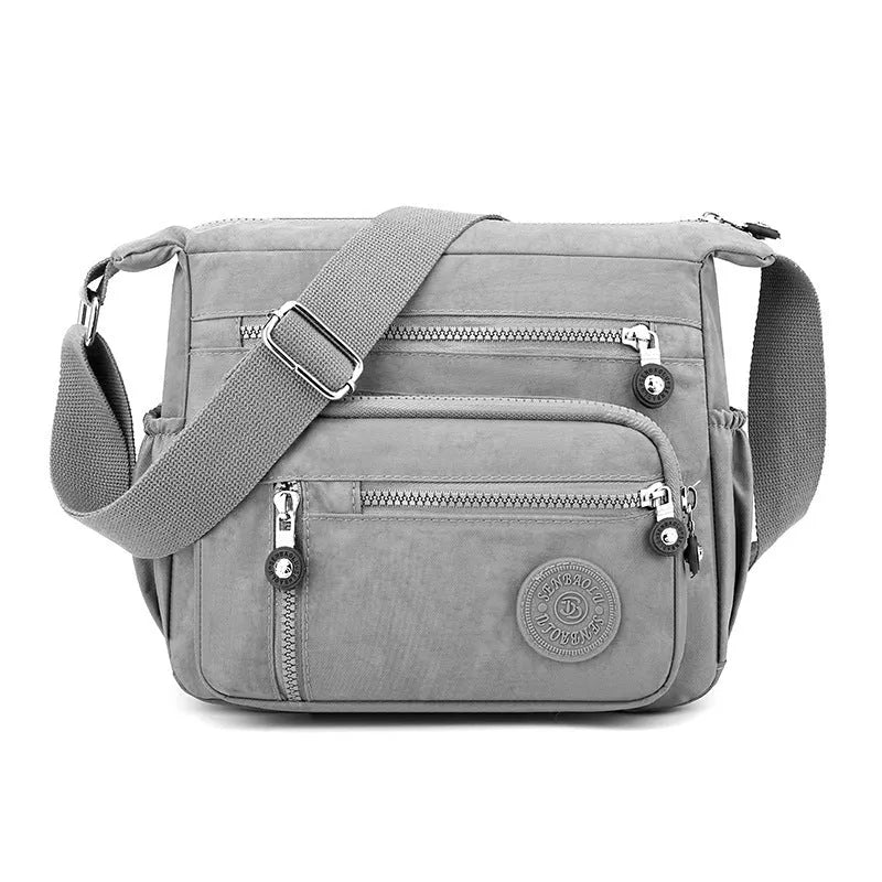 Soft nylon messenger bag in square vertical shape with adjustable shoulder strap