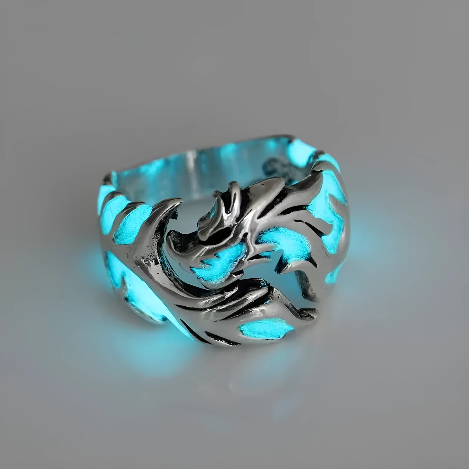 Adjustable metal ring with a luminous Chinese dragon pattern in antiqued silver, blue, and green colours.
