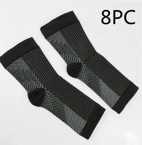 Anti-fatigue compression foot sleeve in black, red, or white, featuring moisture-wicking fabric and a heel hole for breathability.
