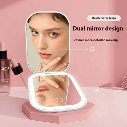 White foldable cosmetic mirror with LED lights showing 10.4x7.5cm glass lens and 105x75mm frame