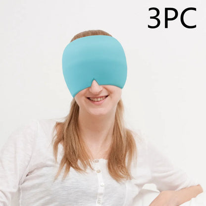 Black elastic cloth gel cold compress eye mask for headache relief on a grey background.