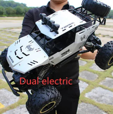 Four-wheel drive remote control car with 2.4G wireless controller on rough terrain