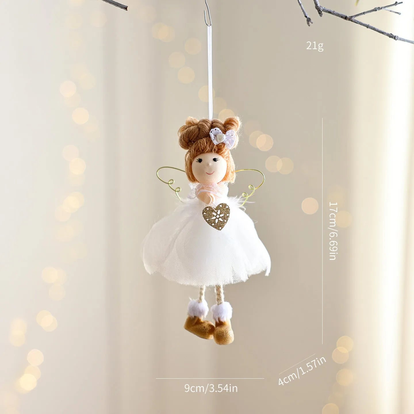 White mesh angel girl Christmas ornament with snowflake detail hanging demonstration