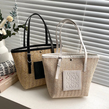 White woven straw women's shoulder bag with a three-dimensional pocket and a black handle.