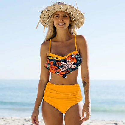 Women's split bikini swimwear set with pleated pants in floral pattern, available in blue and green colours