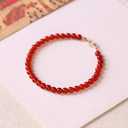 Ultra-thin red agate women's bracelet in classic style on wrist