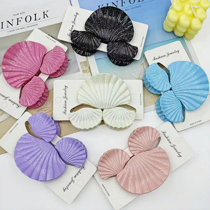 Gradient frosted plastic hair clip set in three pieces with shell decoration