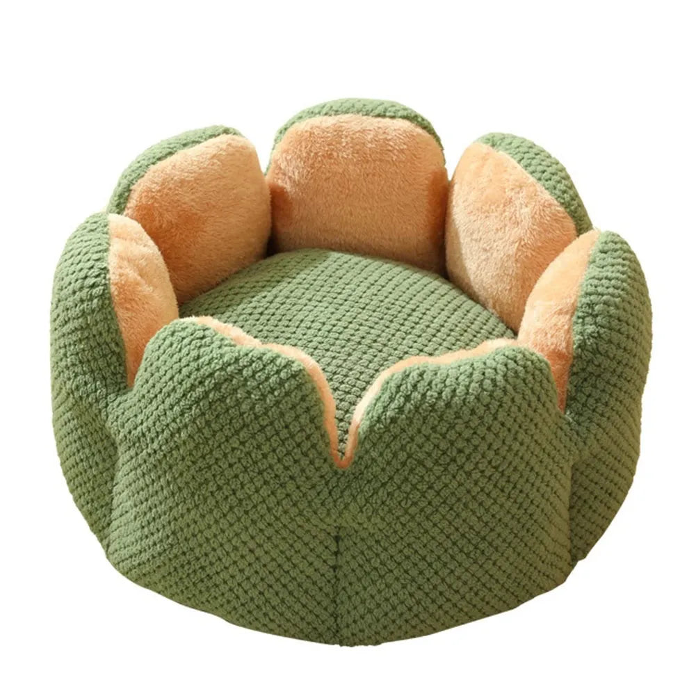 Green petal cactus-shaped plush cat bed with a cave-like opening on a wooden floor