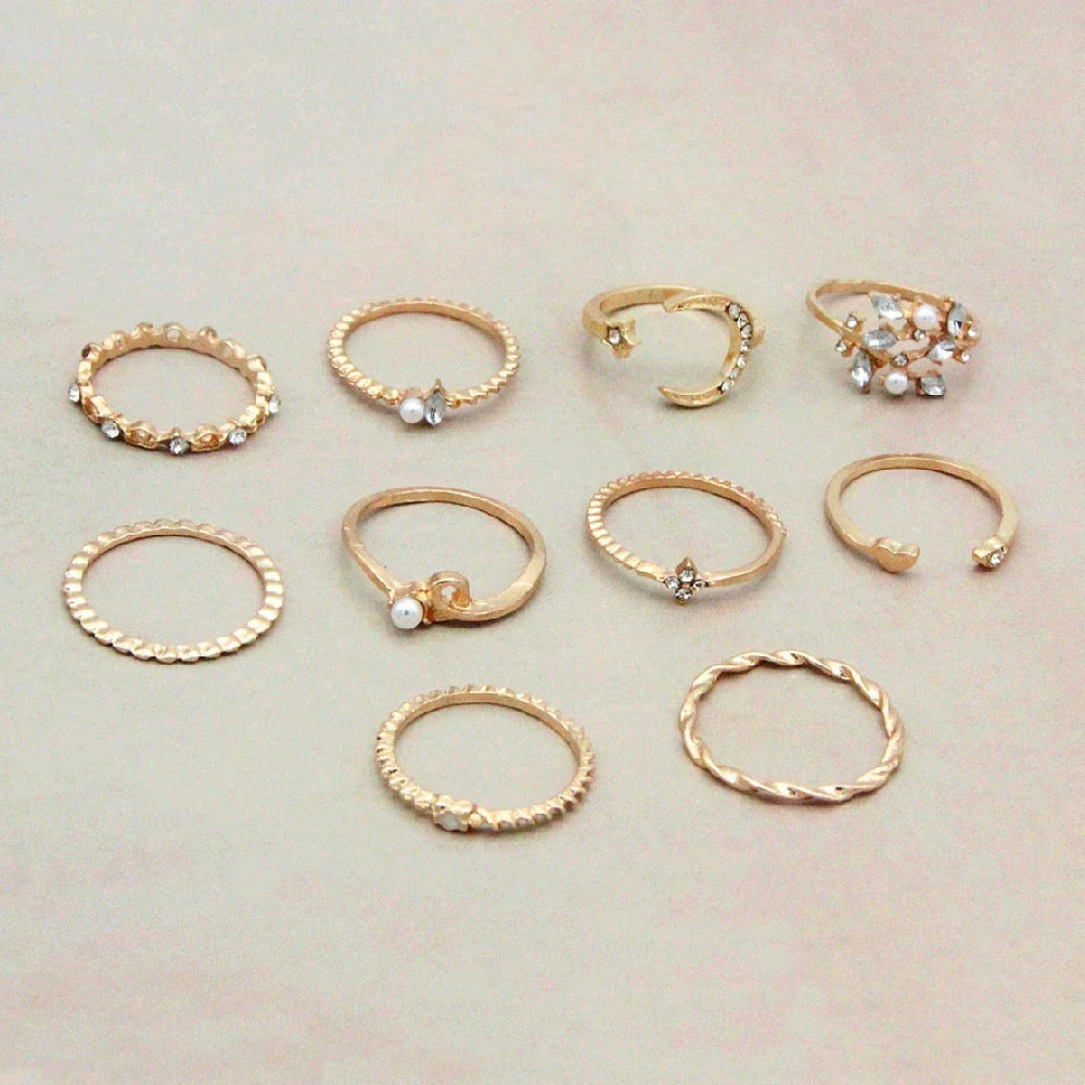 Gold-plated adjustable ring set with moon, star, and leaf charms in a bohemian style