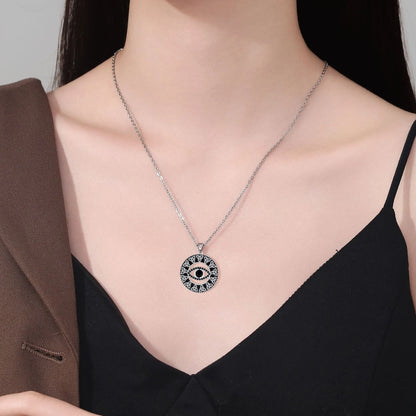Close-up of a women's copper Devil's Eye pendant necklace on a cross chain, showing electroplated finish.
