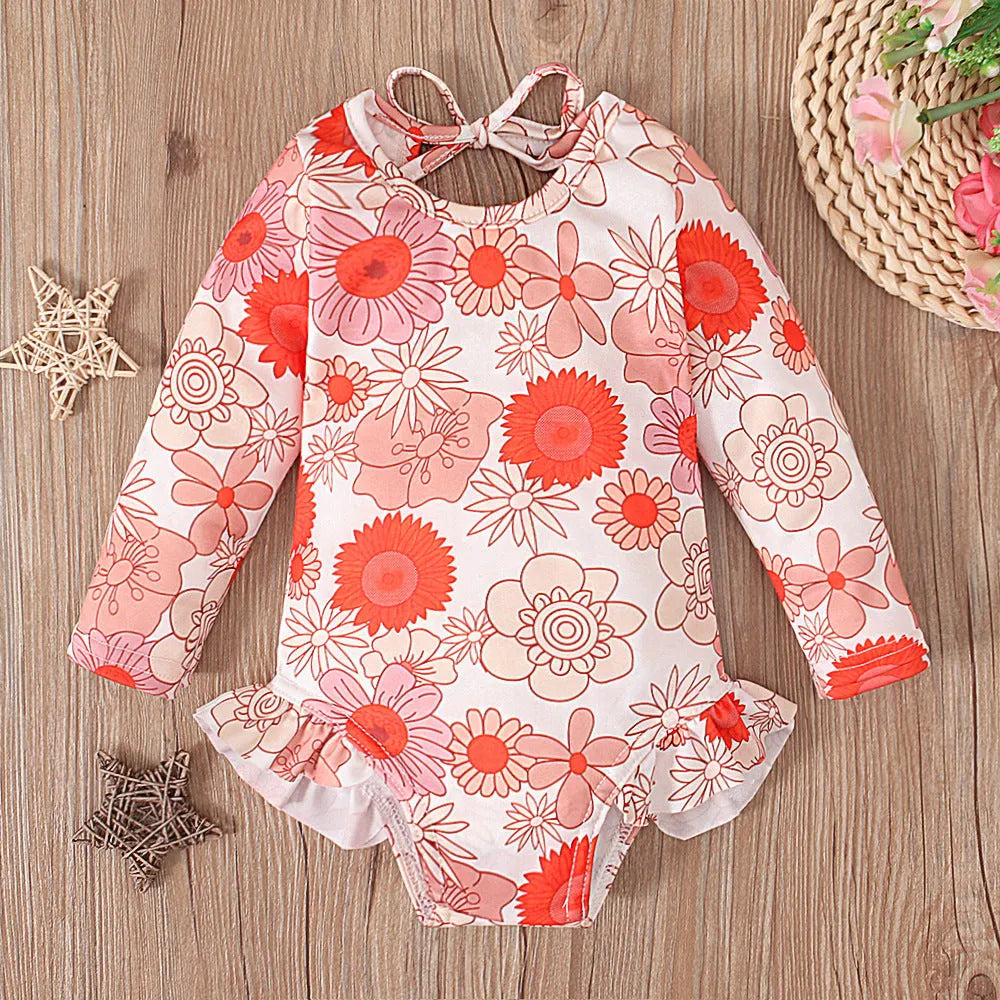 Girl's floral print swimsuit with open back crew neck design in polyester fabric