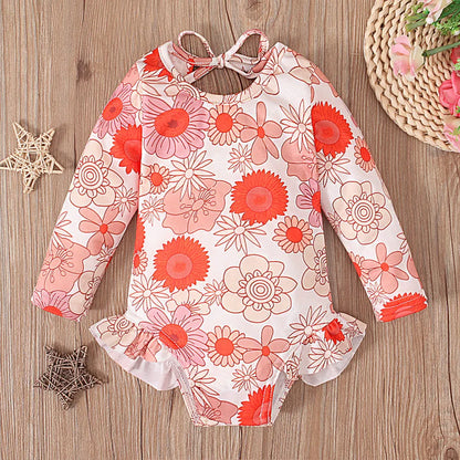 Girl's floral print swimsuit with open back crew neck design in polyester fabric