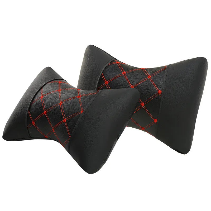 Black leather quilted car headrest with diamond pattern and red stitching lines on cervical support pillow