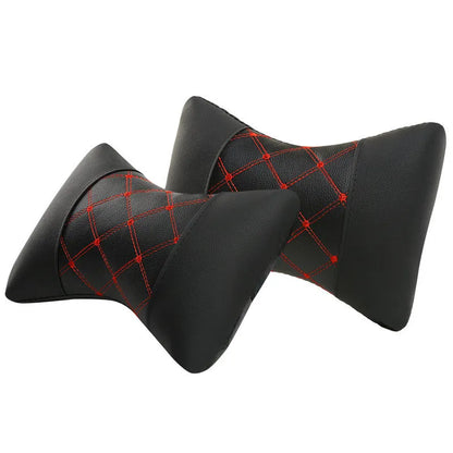 Black leather quilted car headrest with diamond pattern and red stitching lines on cervical support pillow