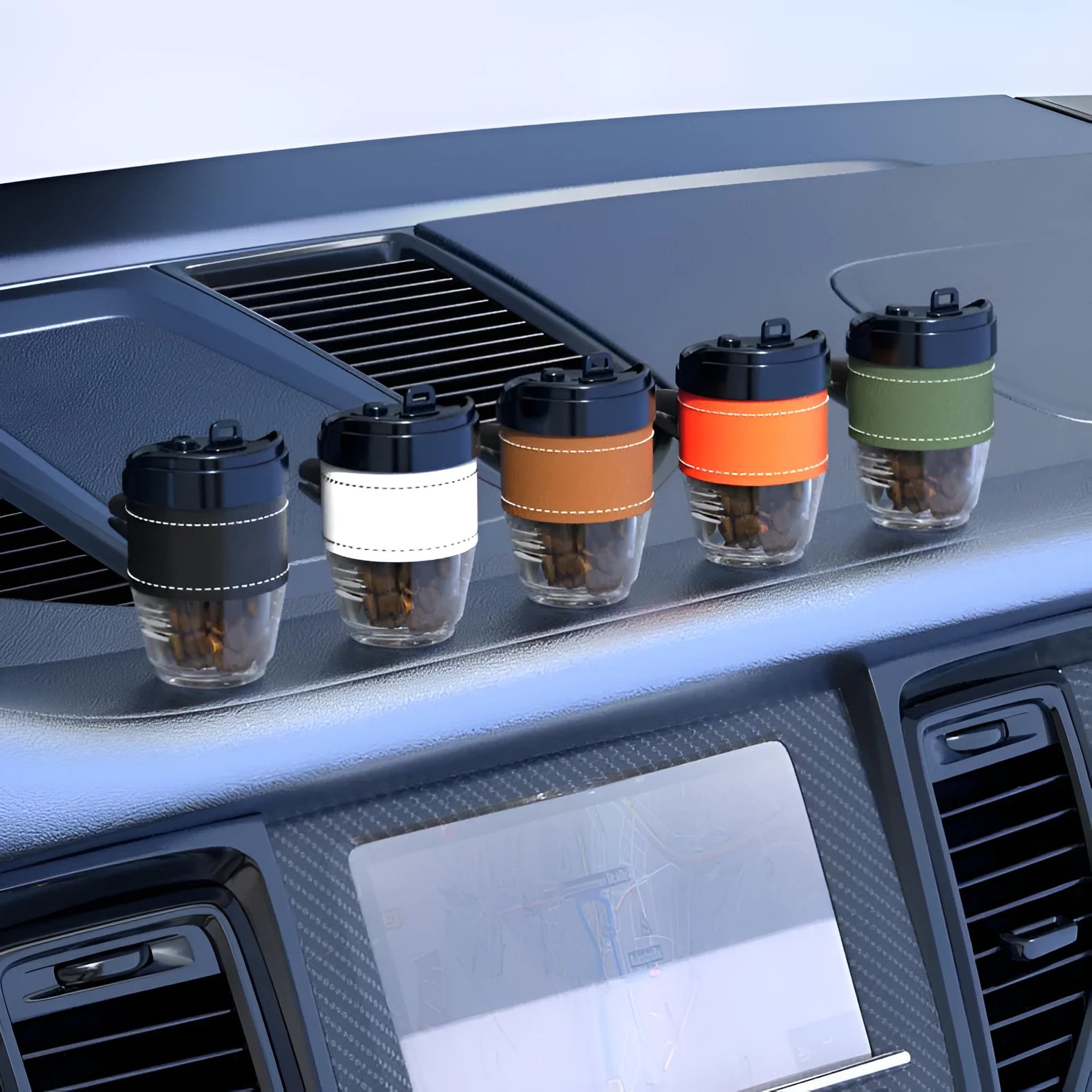 Brown plastic coffee cup-shaped solid car air freshener on a car dashboard.