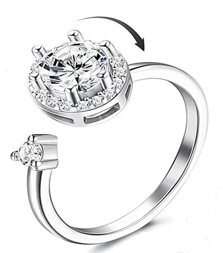 Adjustable spinner ring with rotating floral, geometric, and nature-inspired motifs for women's fashion and stress relief