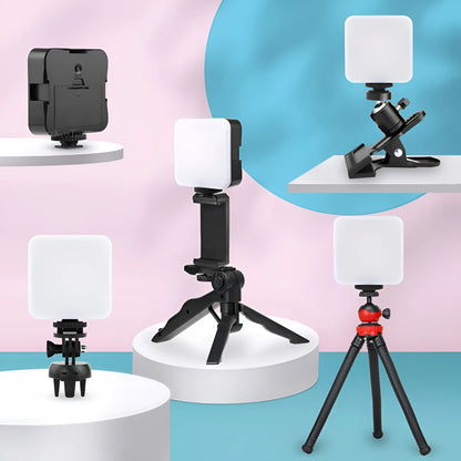 Square LED camera flash with universal hot shoe mount and rotatable head, shown with optional octopus stand tripod.