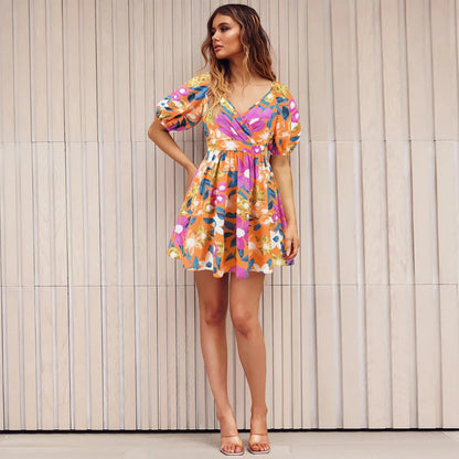 Stylish floral mini dress with V-neck and lantern sleeves, perfect for summer vacations and beach outings