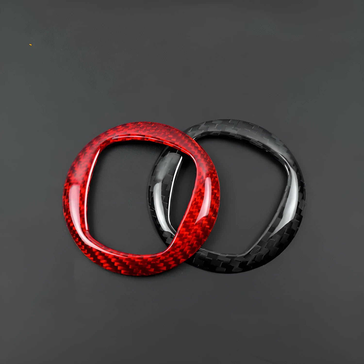 Carbon fiber steering wheel cover shown in black and red colour options for vehicle interior enhancement