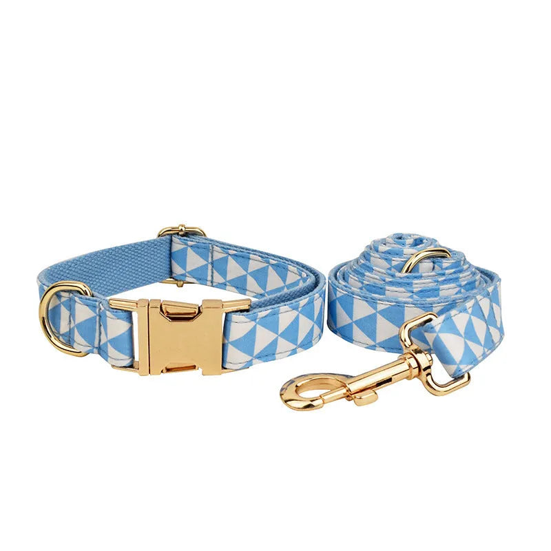 Blue cloth dog accessory set with collar, leash, bow, and vest shown together